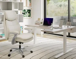 Realspace® Everton Ergonomic Vegan Leather High-Back Executive Chair with Flip-Up Armrests, Beige/Silver, BIFMA Compliant